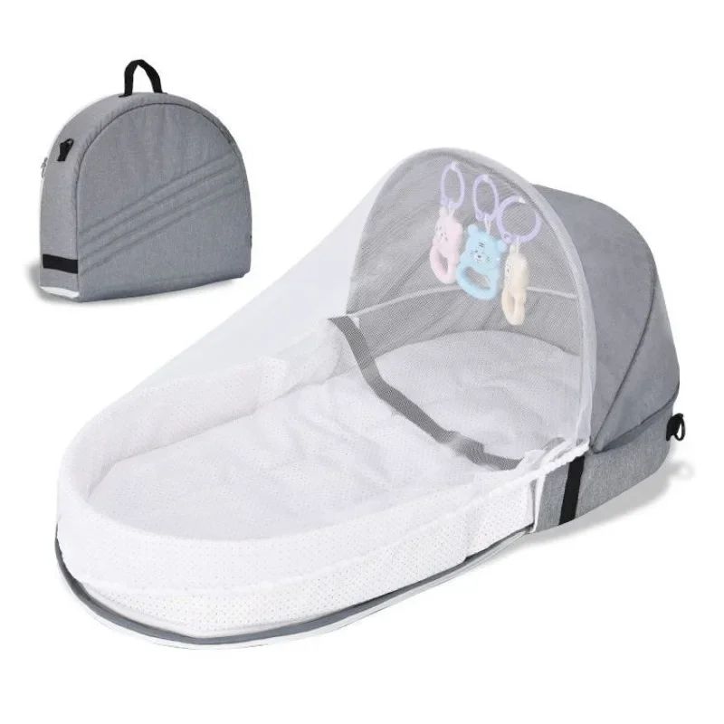 Reducteur de lit bébé gris avec moustiquaire et sac de transport