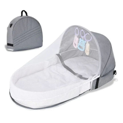 Reducteur de lit bébé gris avec moustiquaire et sac de transport