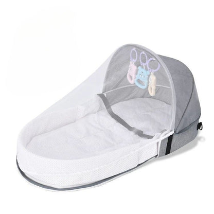 Reducteur de lit bébé gris avec filet anti-moustiques