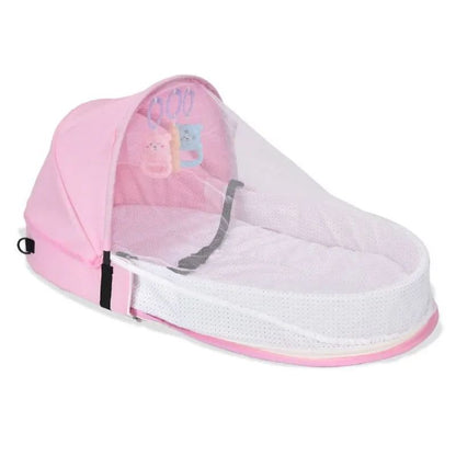 Reducteur de lit bébé rose avec moustiquaire respirante