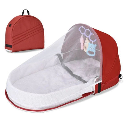 Reducteur de lit bébé rouge avec moustiquaire et sac de transport